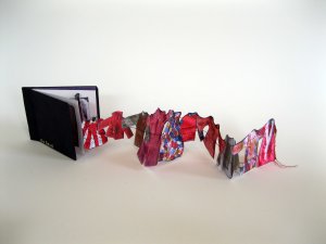 "She Sews" is an accordion book I made as homage to my mom who made so many clothes for herself, her kids, and her kids' dolls!