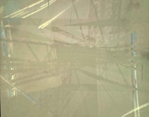 This is the resulting image from the Nickle Bridge. Just 4 days before I arrived to retrieve the camera, a couple must've thought it was a geocache site. They opened it up, signed their names to the photo paper, and left behind a shamrock charm.